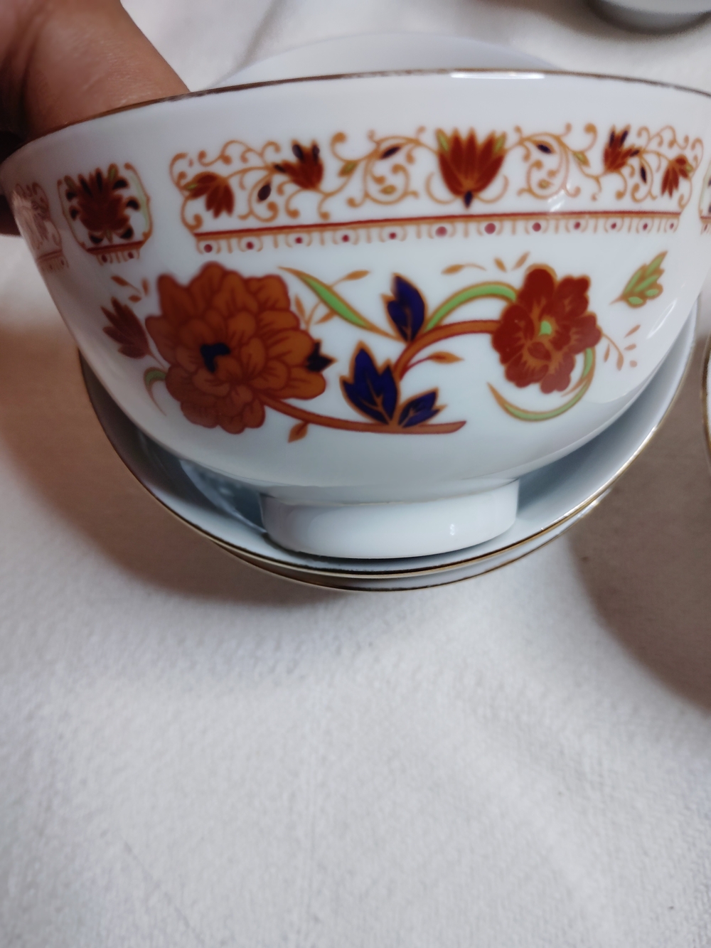Decorative White Porcelain Bowl with Orange Floral Motif